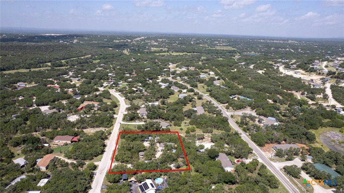 857 Derrick Drive Spring Branch, TX 78070 - Photo 31 of 32 an aerial view of residential houses with city and green space