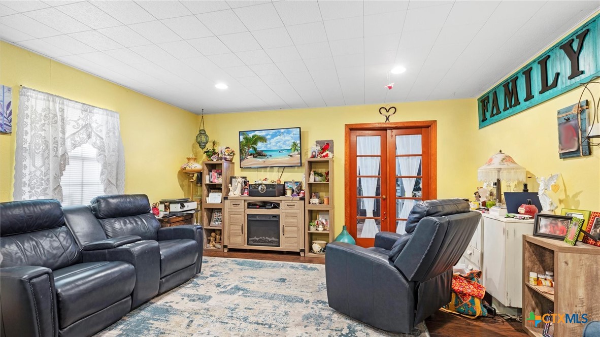 857 Derrick Drive Spring Branch, TX 78070 - Photo 7 of 32 a living room with furniture and a flat screen tv