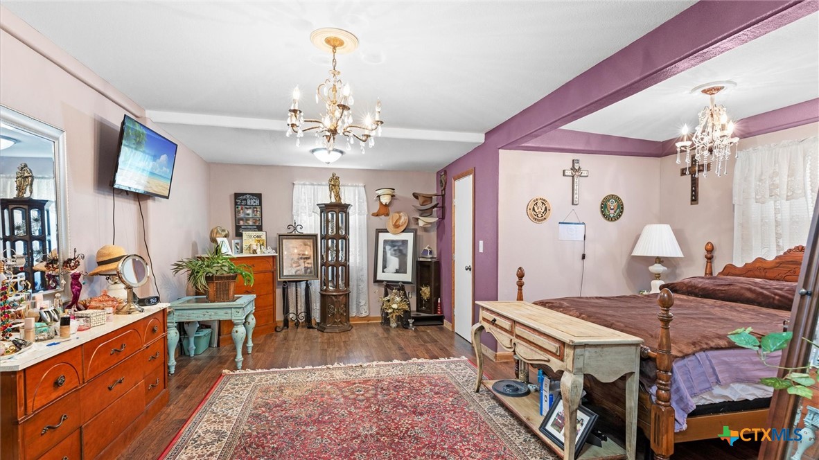 857 Derrick Drive Spring Branch, TX 78070 - Photo 10 of 32 a very nice looking room with kitchen countertop a rug a fireplace and a chandelier