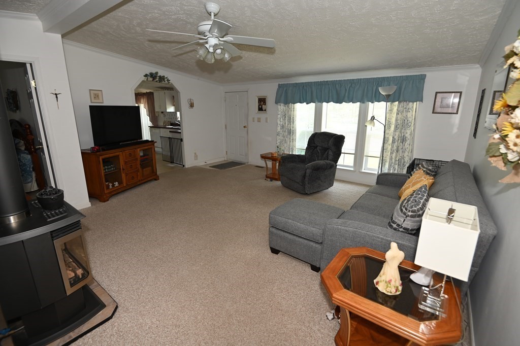 43 Longboat Road Wareham, MA 02571 - Photo 7 of 24 a living room with furniture a flat screen tv and a window