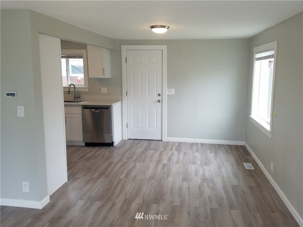 58 Shattuck Avenue South Renton, WA 98057 - Photo 3 of 13 an empty room with wooden floor and a window