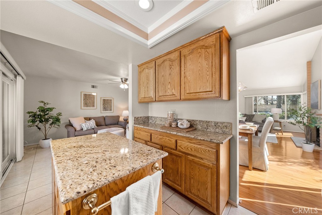 1869 Sugarloaf Avenue Upland, CA 91784 - Photo 13 of 41 a kitchen with a stove a sink a refrigerator and a counter space