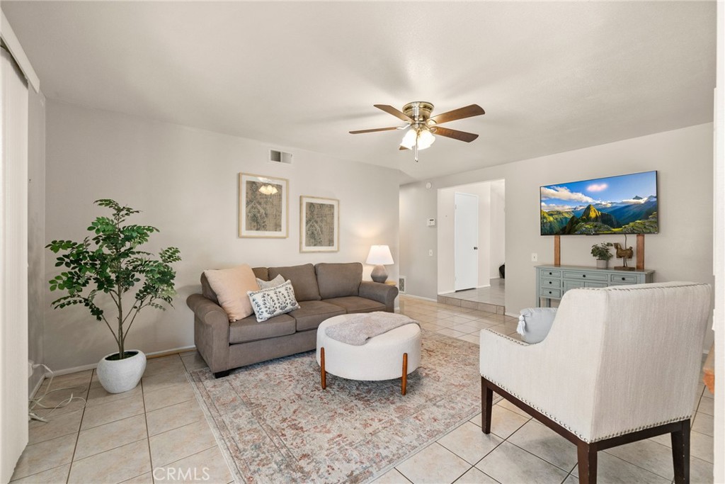 1869 Sugarloaf Avenue Upland, CA 91784 - Photo 15 of 41 a living room with furniture and a potted plant
