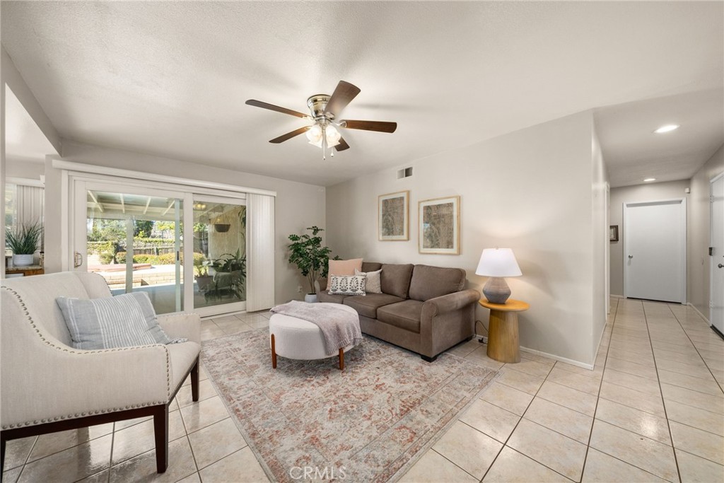 1869 Sugarloaf Avenue Upland, CA 91784 - Photo 17 of 41 a living room with furniture and a large window