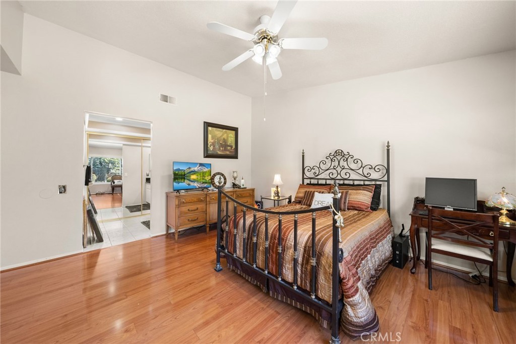 1869 Sugarloaf Avenue Upland, CA 91784 - Photo 19 of 41 a bedroom with furniture and a wooden floor