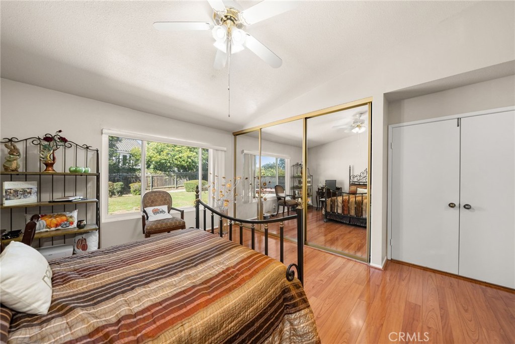 1869 Sugarloaf Avenue Upland, CA 91784 - Photo 20 of 41 a living room with furniture a flat screen tv and a floor to ceiling window