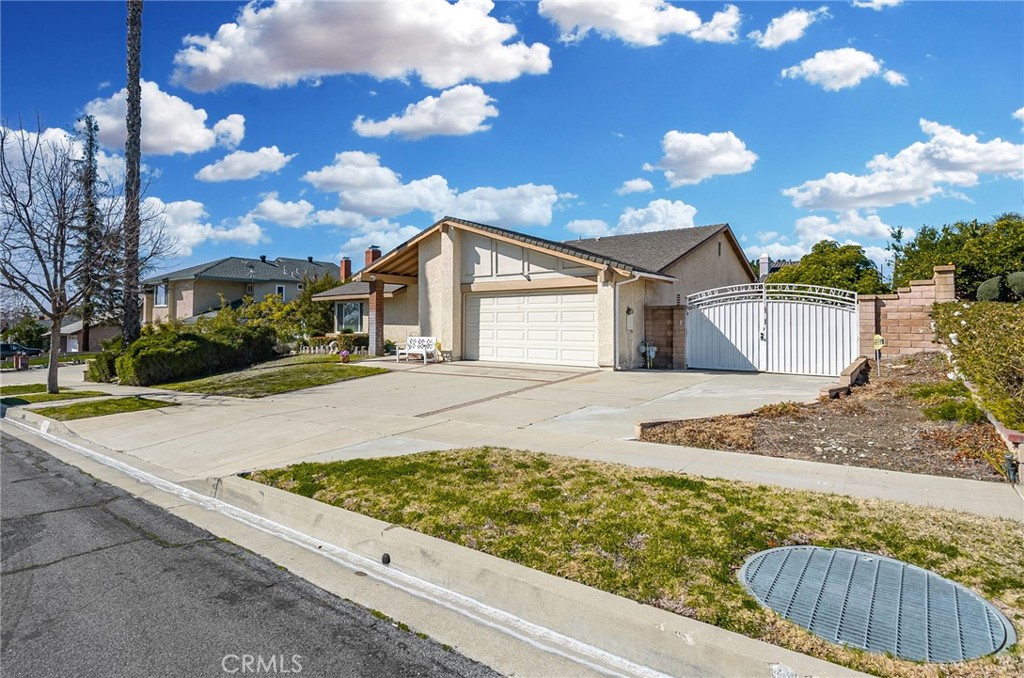 1869 Sugarloaf Avenue Upland, CA 91784 - Photo 2 of 41 a front view of a house with garden