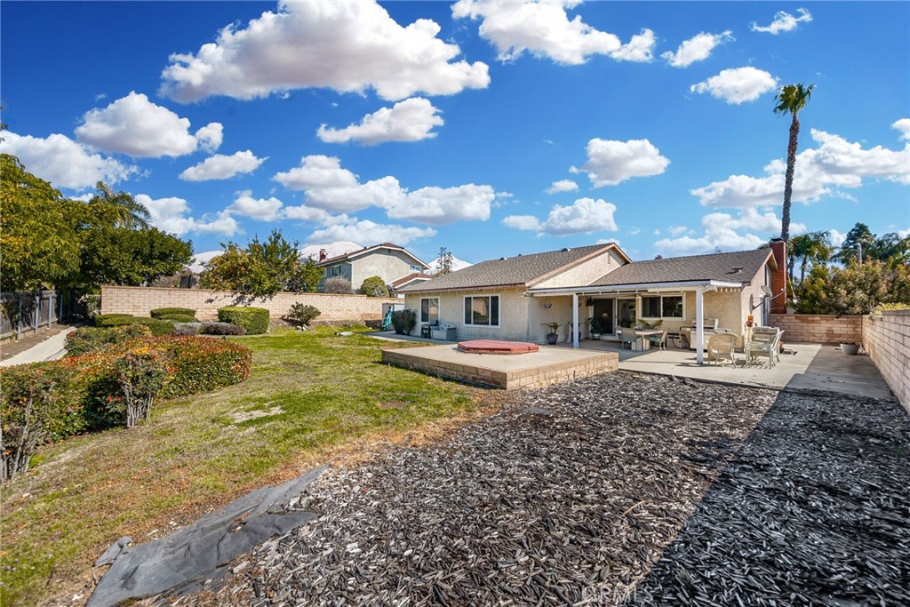 1869 Sugarloaf Avenue Upland, CA 91784 - Photo 27 of 41 a front view of a house with garden
