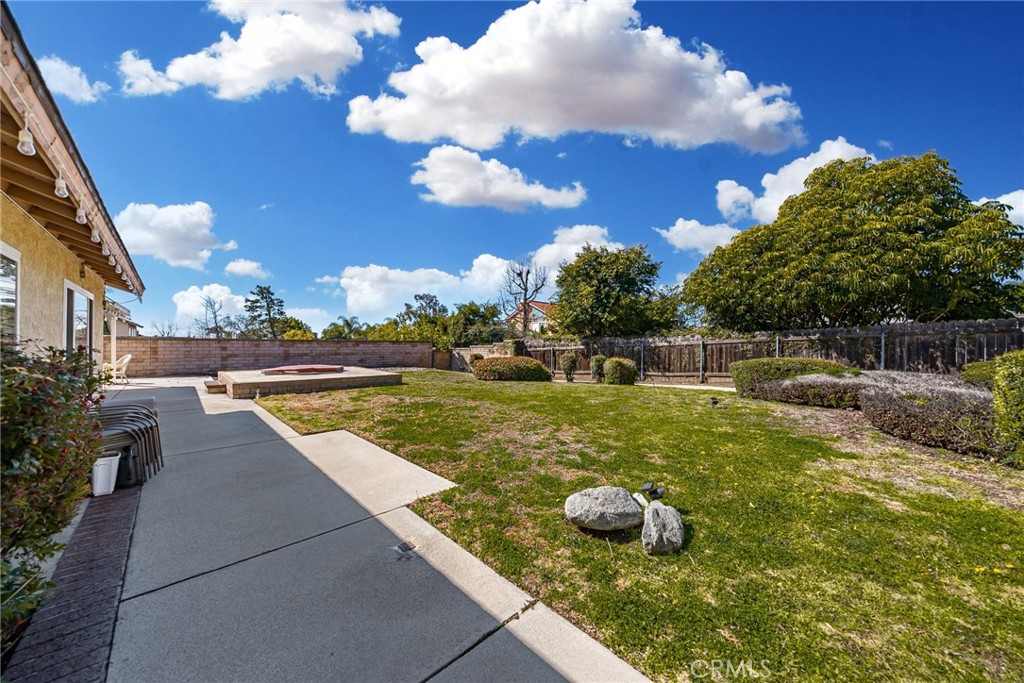 1869 Sugarloaf Avenue Upland, CA 91784 - Photo 30 of 41 a view of a swimming pool with an outdoor space and seating area