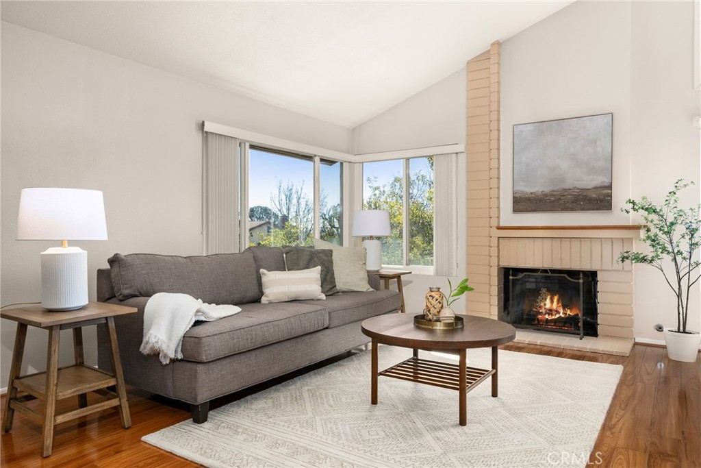 1869 Sugarloaf Avenue Upland, CA 91784 - Photo 6 of 41 a living room with furniture and a fireplace