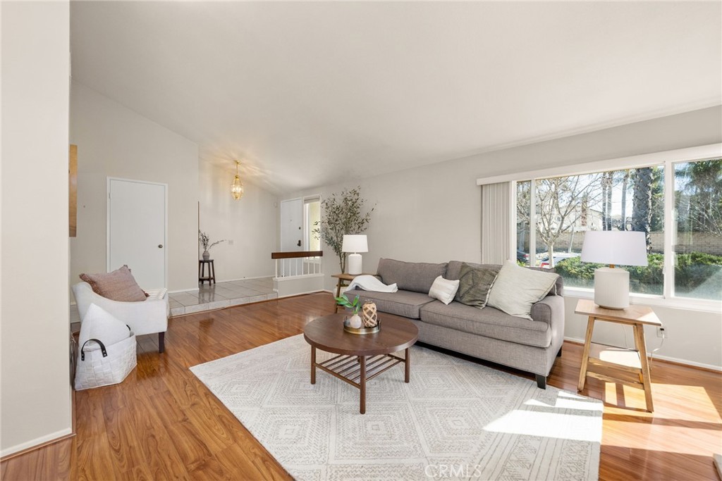 1869 Sugarloaf Avenue Upland, CA 91784 - Photo 7 of 41 a living room with furniture and a large window