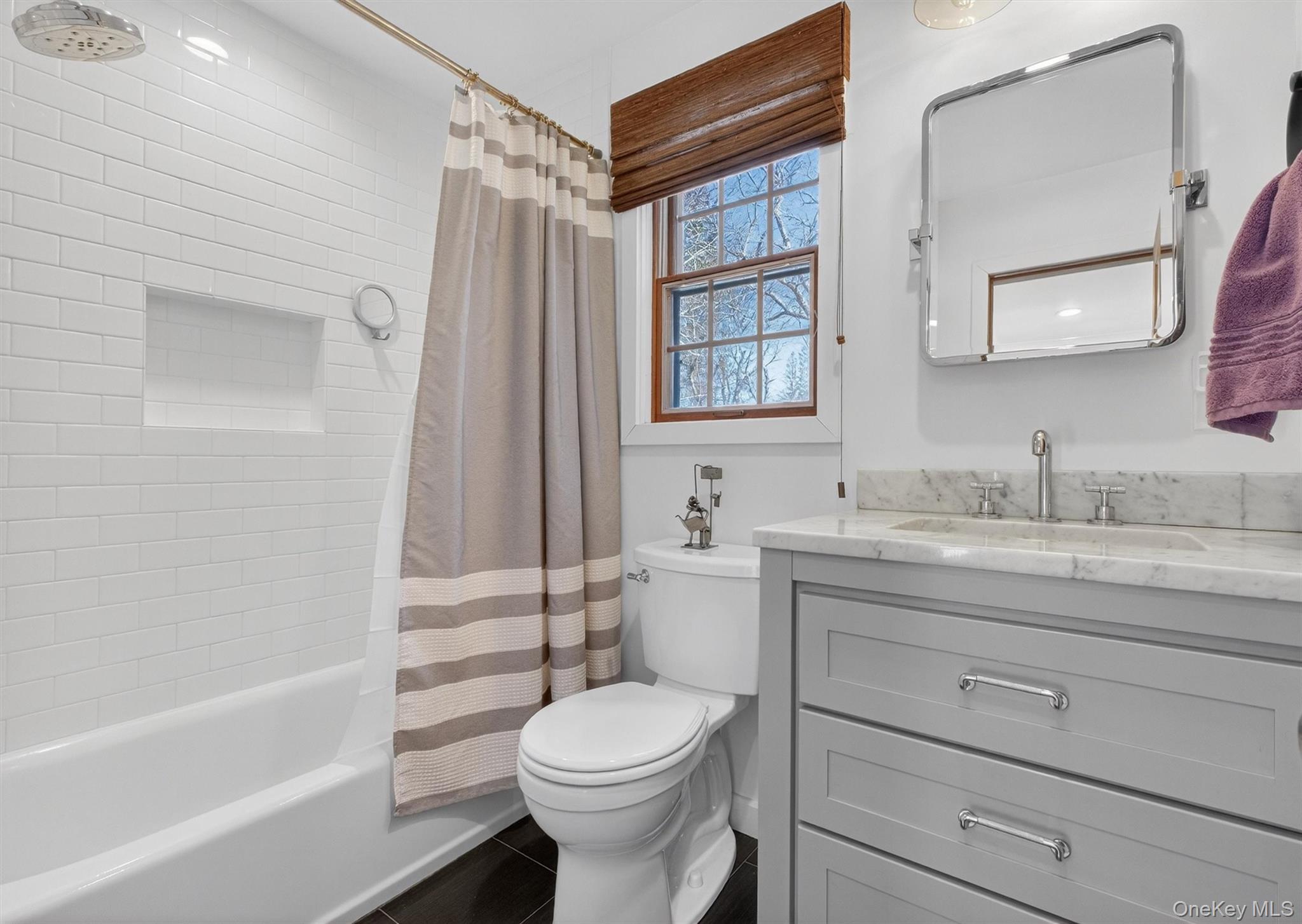 208 Ressique Road Carmel, NY 10512 - Photo 24 of 40 Updated Bathroom (2019) - marble counter top, tiled floor, subway tiled bath w/recessed shelf, Brizo faucets & showerhead.