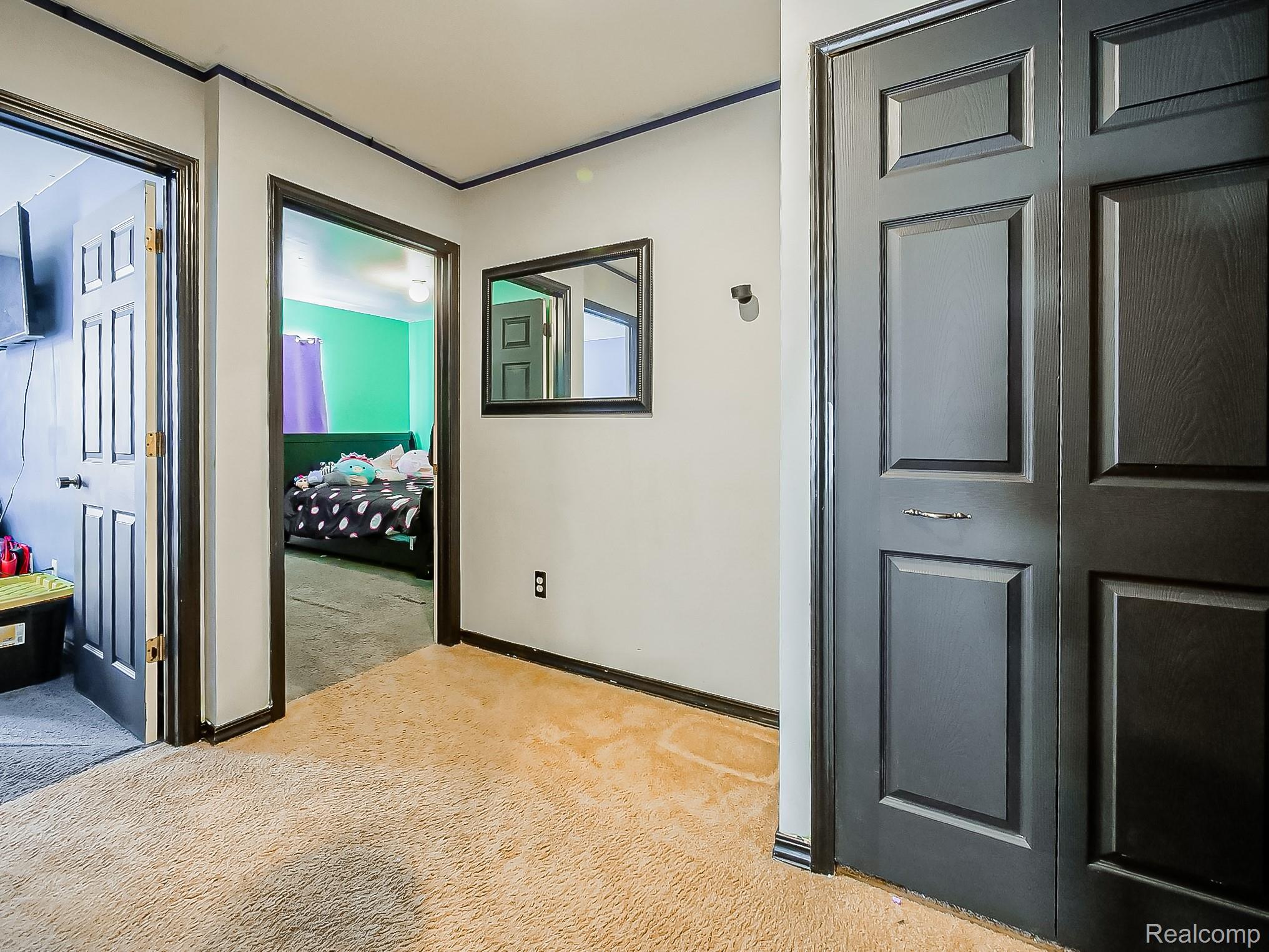 34460 Van Born Road Wayne, MI 48184 - Photo 17 of 31 Corridor with light carpet and baseboards