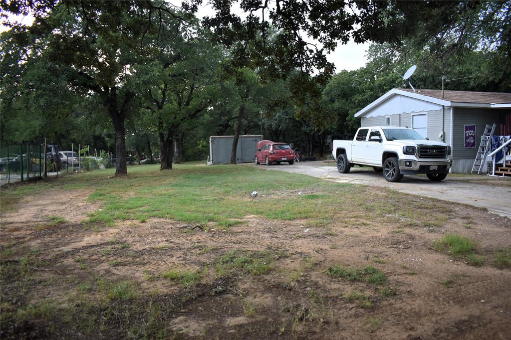 4550 Dick Price Road Fort Worth, TX 76140 - Photo 14 of 21 a front view of a house with garden