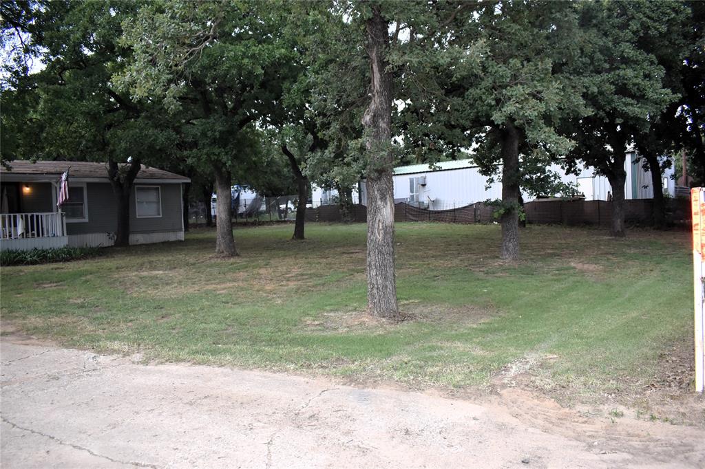 4550 Dick Price Road Fort Worth, TX 76140 - Photo 16 of 21 a backyard of a house with lots of green space
