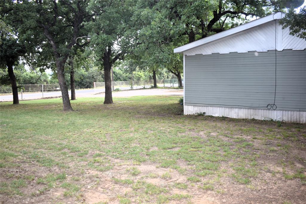 4550 Dick Price Road Fort Worth, TX 76140 - Photo 19 of 21 a backyard of a house with lots of green space