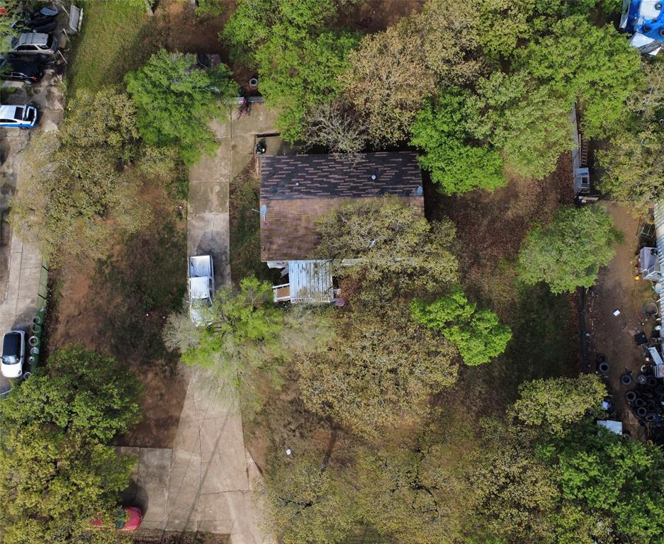 4550 Dick Price Road Fort Worth, TX 76140 - Photo 2 of 21 a view of a yard with plants and large trees