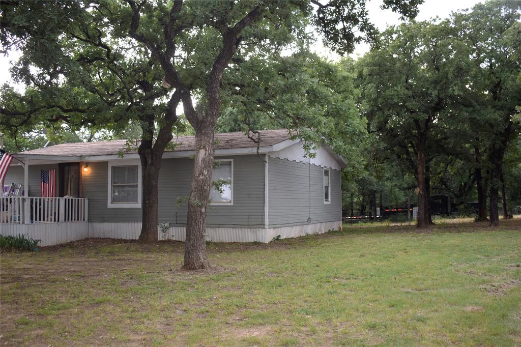 4550 Dick Price Road Fort Worth, TX 76140 - Photo 6 of 21 a house with trees in the background