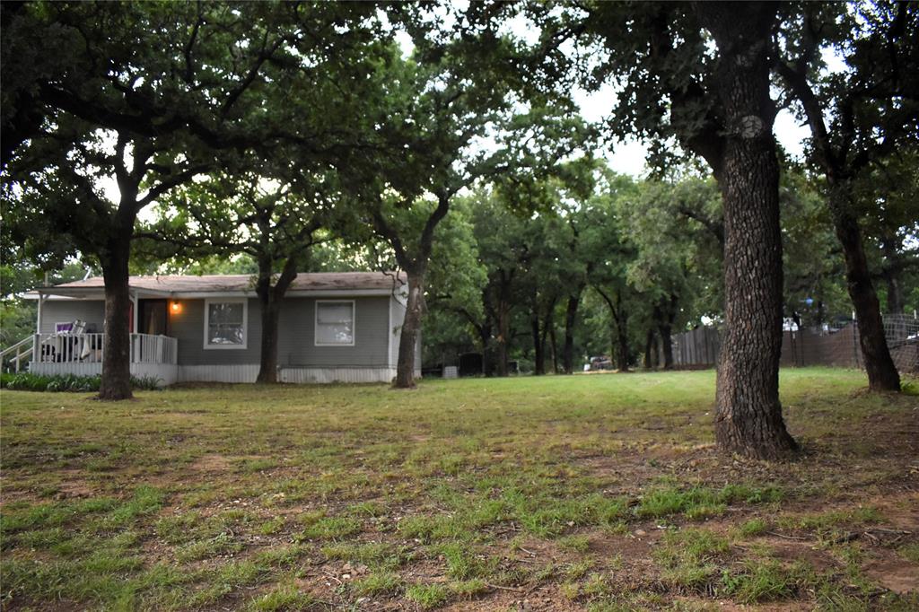 4550 Dick Price Road Fort Worth, TX 76140 - Photo 7 of 21 a house that has a tree in front of a house