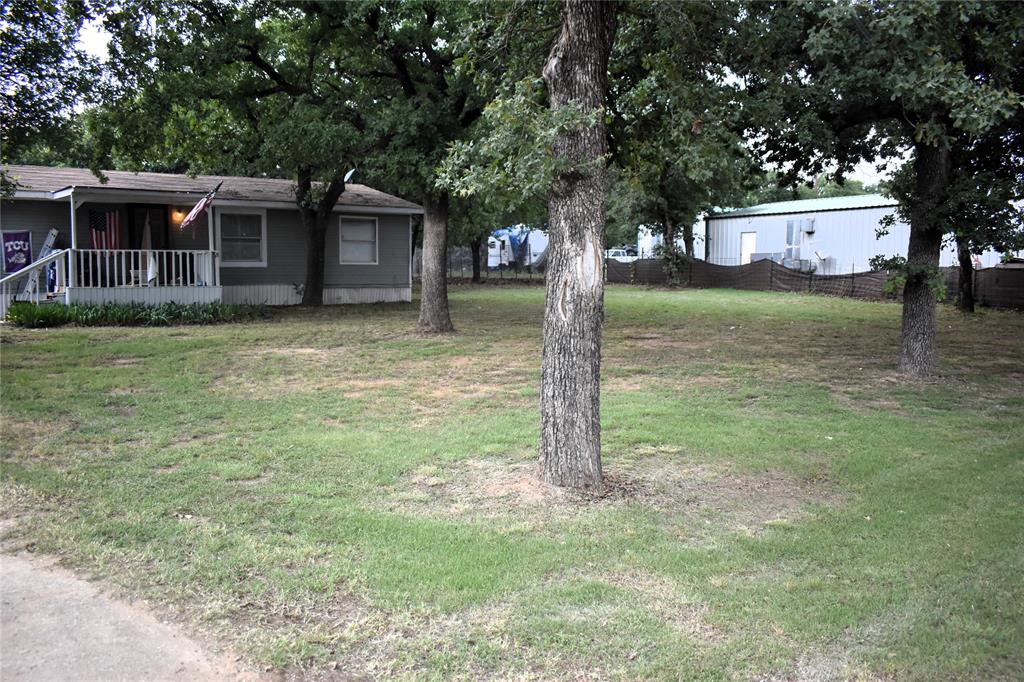 4550 Dick Price Road Fort Worth, TX 76140 - Photo 9 of 21 a view of a house with a backyard