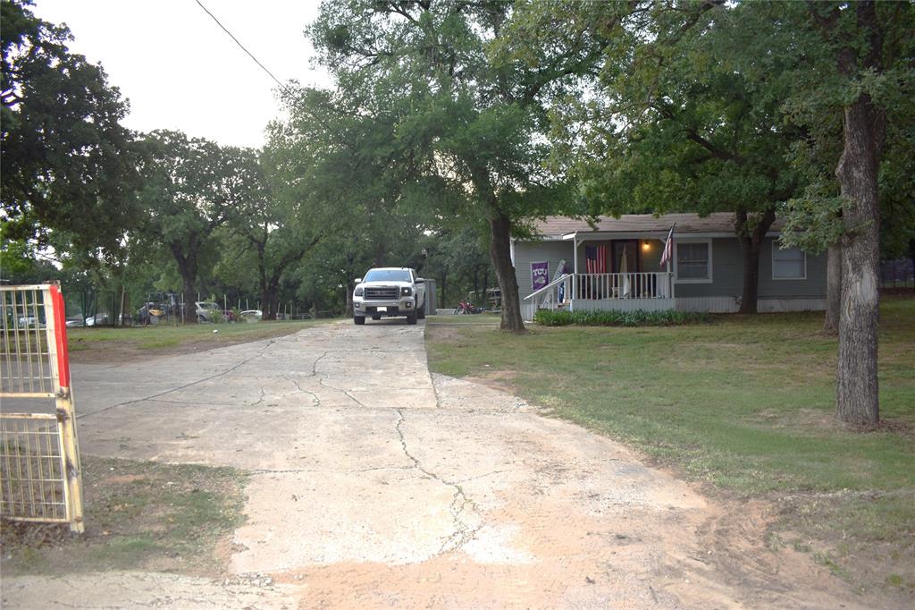 4550 Dick Price Road Fort Worth, TX 76140 - Photo 10 of 21 a view of a house with a yard and tree s