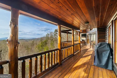a view of roof deck with a yard