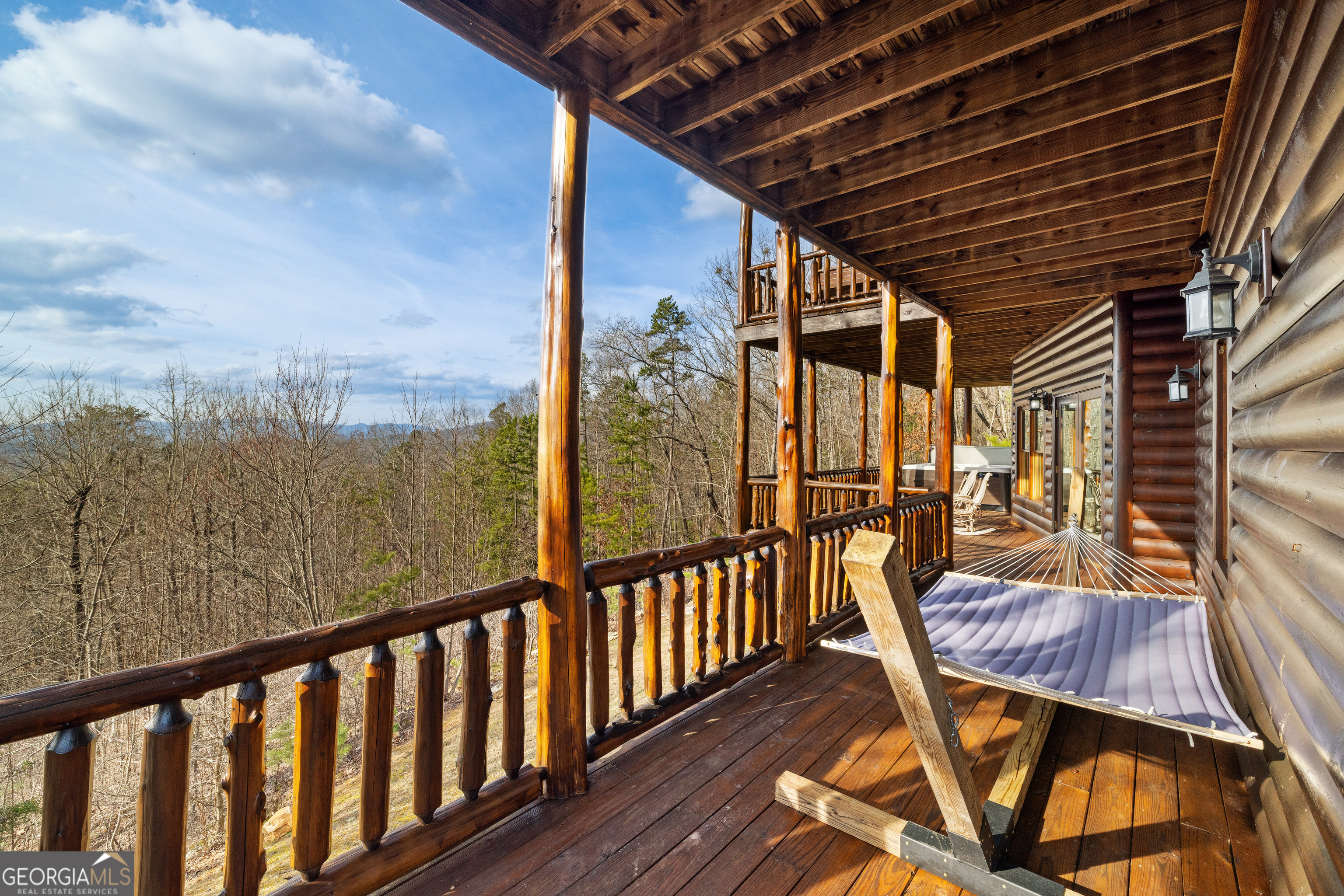 180 Cinnamon Bear Road Mineral Bluff, GA 30559 - Photo 26 of 49 a view of a balcony with furniture