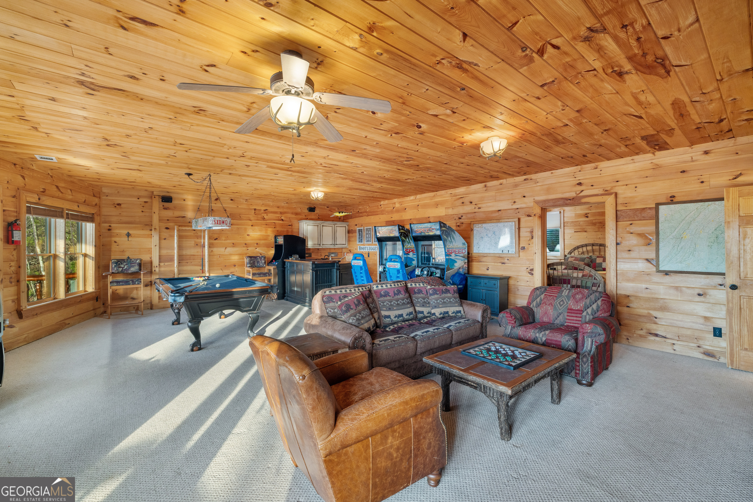 180 Cinnamon Bear Road Mineral Bluff, GA 30559 - Photo 35 of 49 a living room with furniture and a chandelier