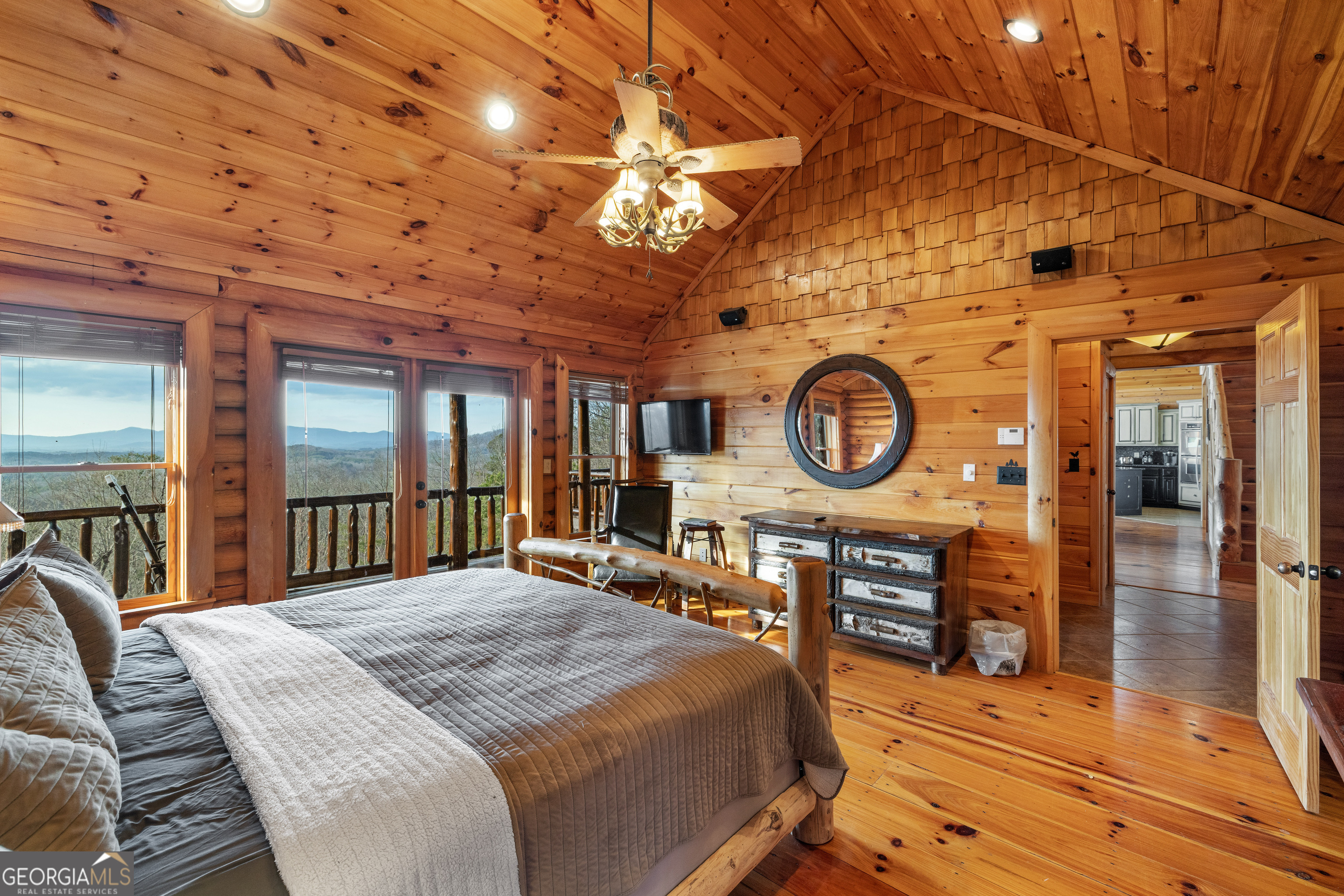 180 Cinnamon Bear Road Mineral Bluff, GA 30559 - Photo 37 of 49 a bedroom with a large bed and a large window