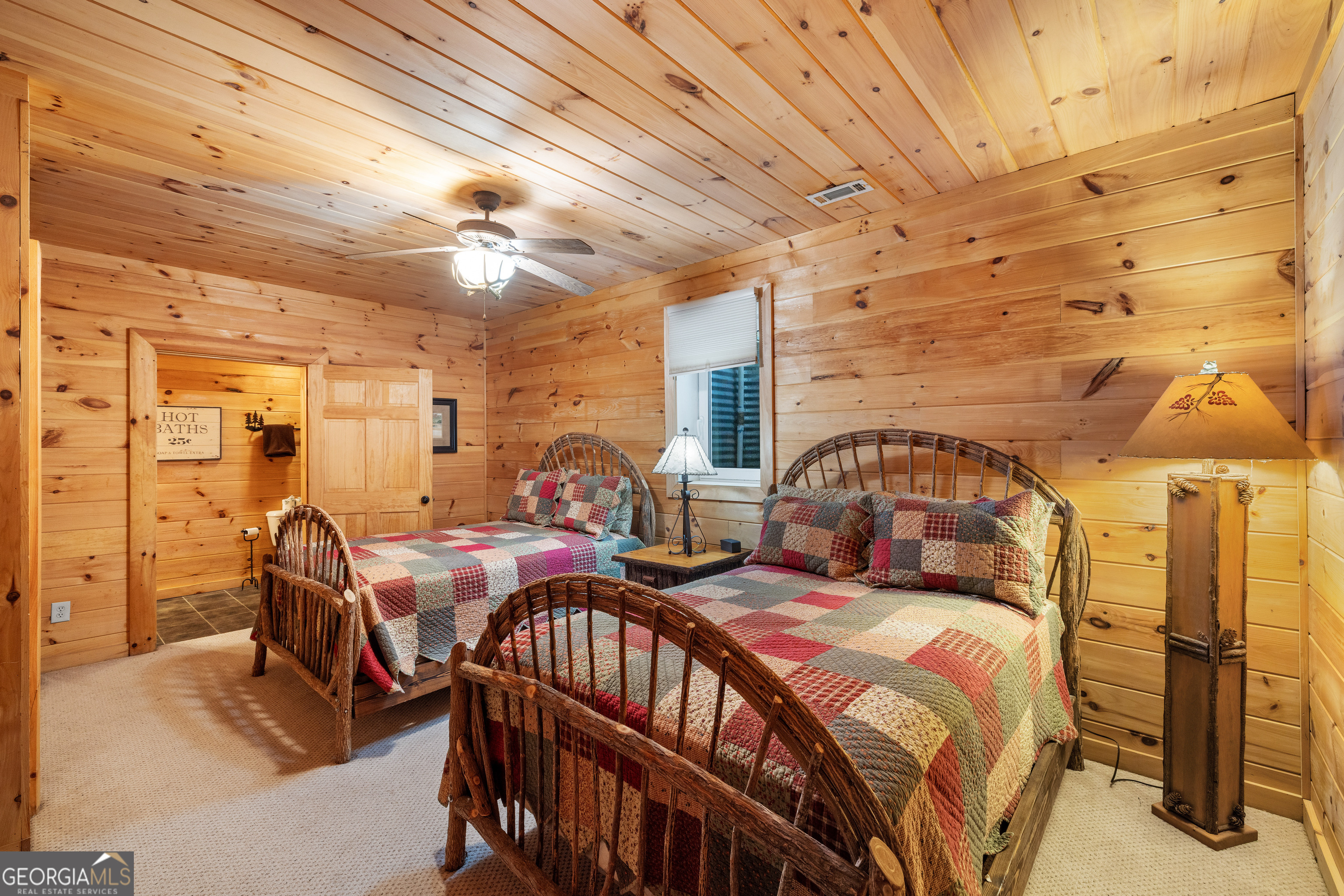 180 Cinnamon Bear Road Mineral Bluff, GA 30559 - Photo 38 of 49 a bed room with two beds and a chandelier