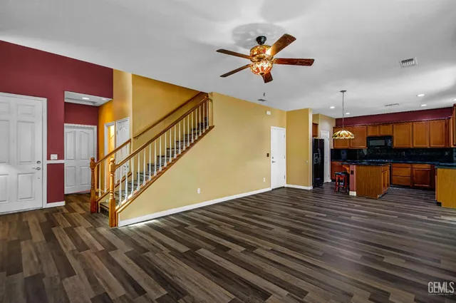 a view of an empty room and wooden floor