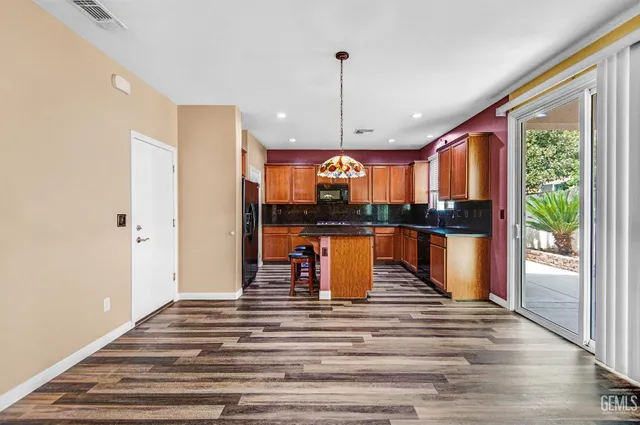 a water view of kitchen with wooden floor