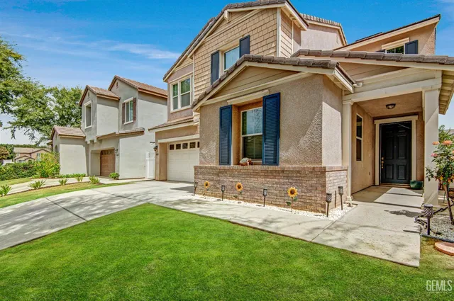 a view of a brick house with a large windows
