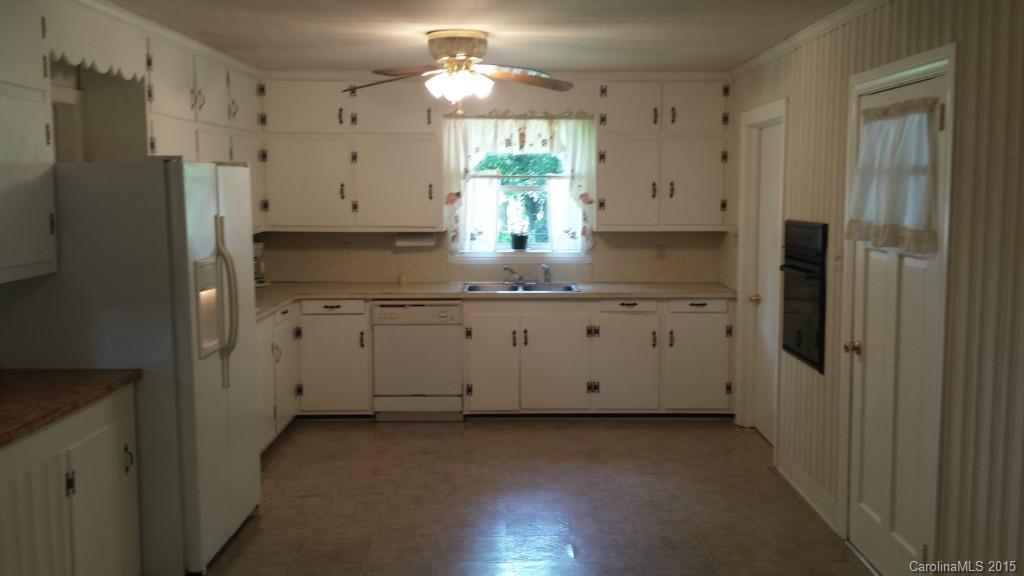 87 Lee Road Stony Point, NC 28678 - Photo 14 of 24 a kitchen with stainless steel appliances a window and a refrigerator