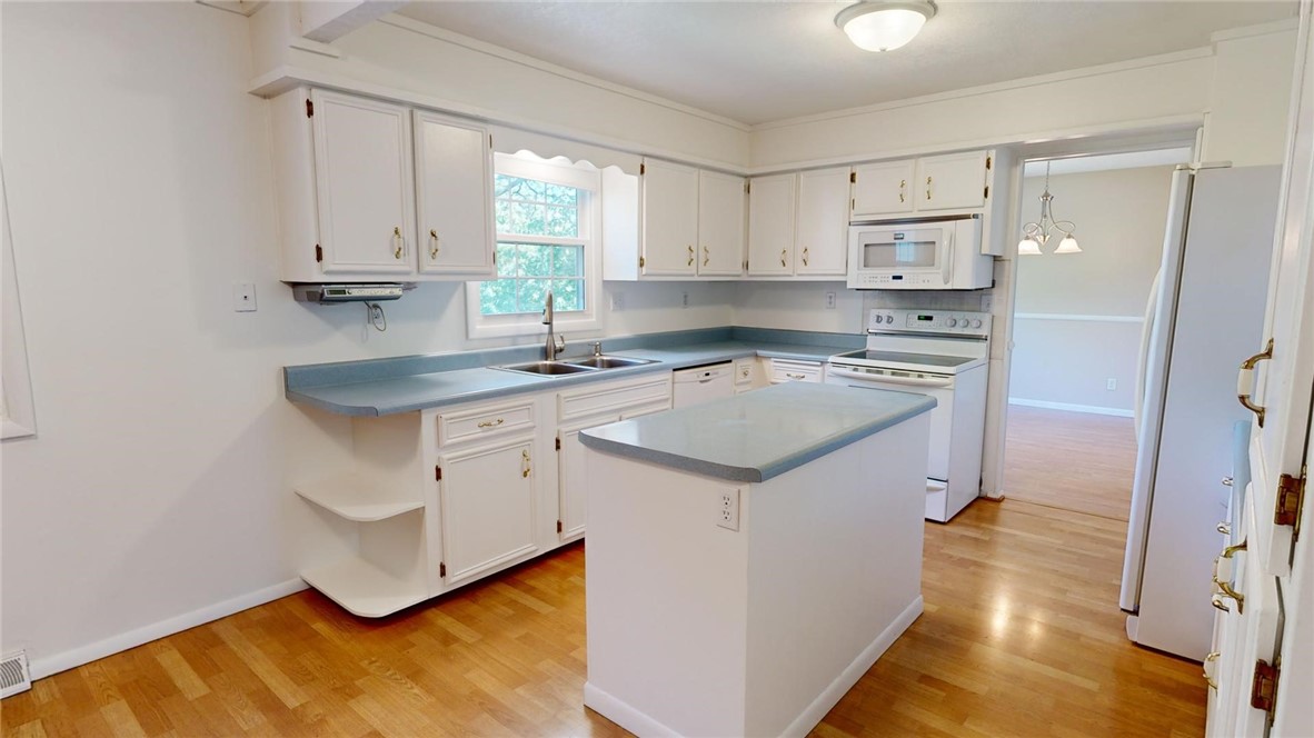 396 West Ash Avenue Decatur, IL 62526 - Photo 8 of 37 a kitchen with a sink stove and cabinets