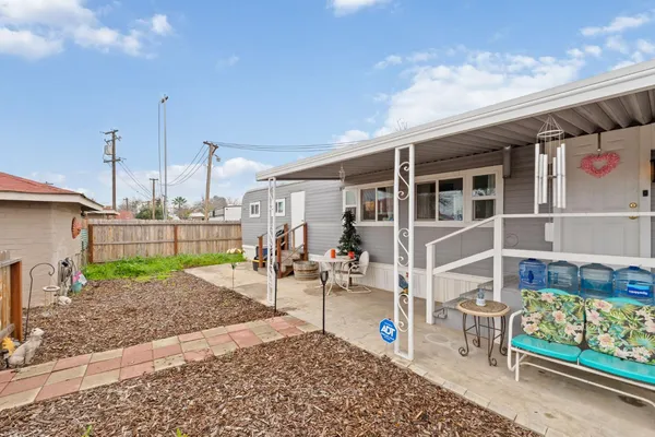 a view of a patio with a table and chairs