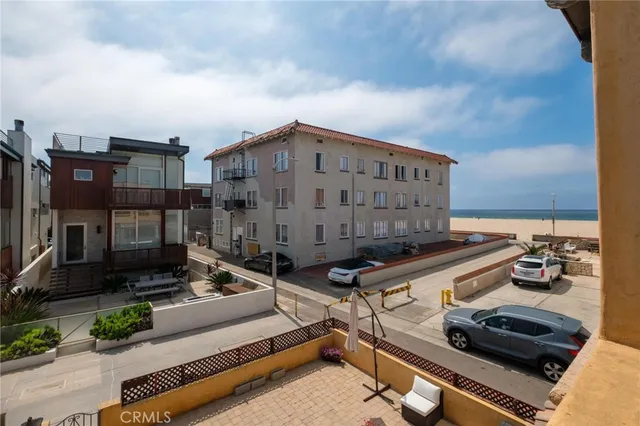 a view of a balcony with wooden floor and city view