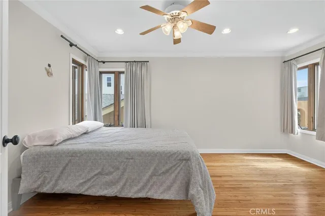 a bedroom with a large bed and a large window