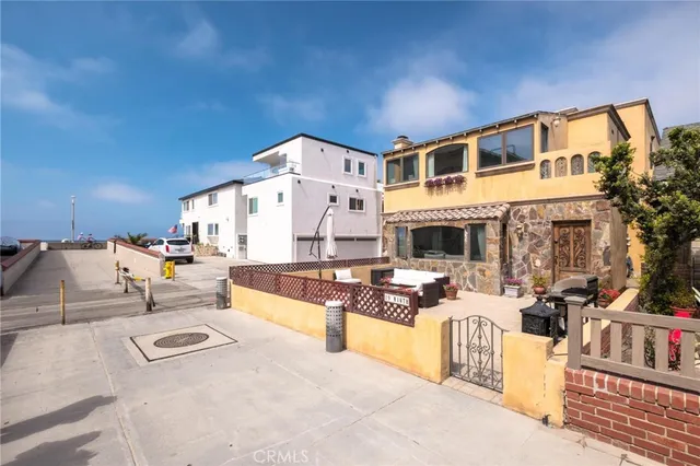 a view of a house with swimming pool and sitting area