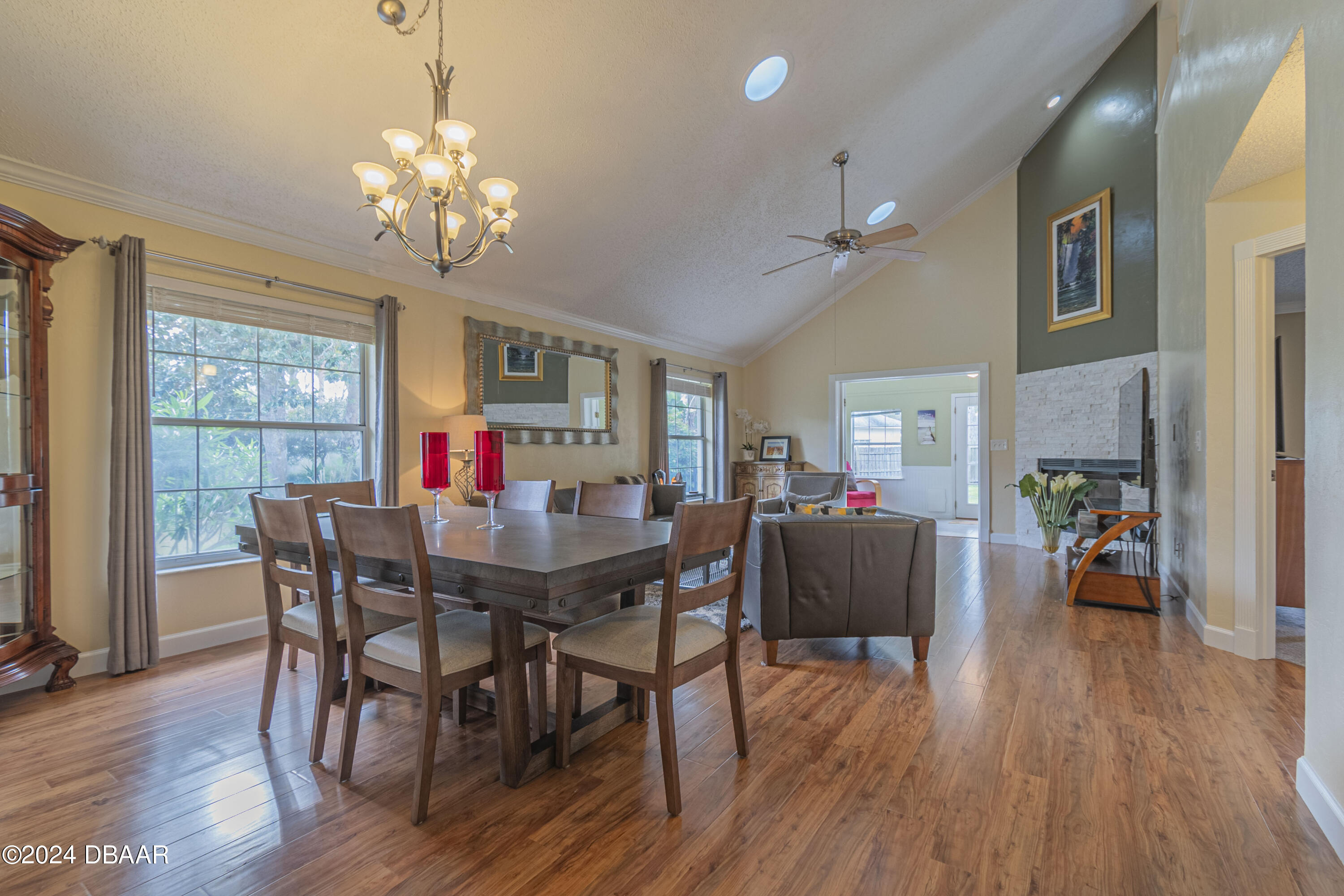 6236 Clover Bend Drive Port Orange, FL 32127 - Photo 12 of 73 a view of a dining room with furniture a chandelier and wooden floor