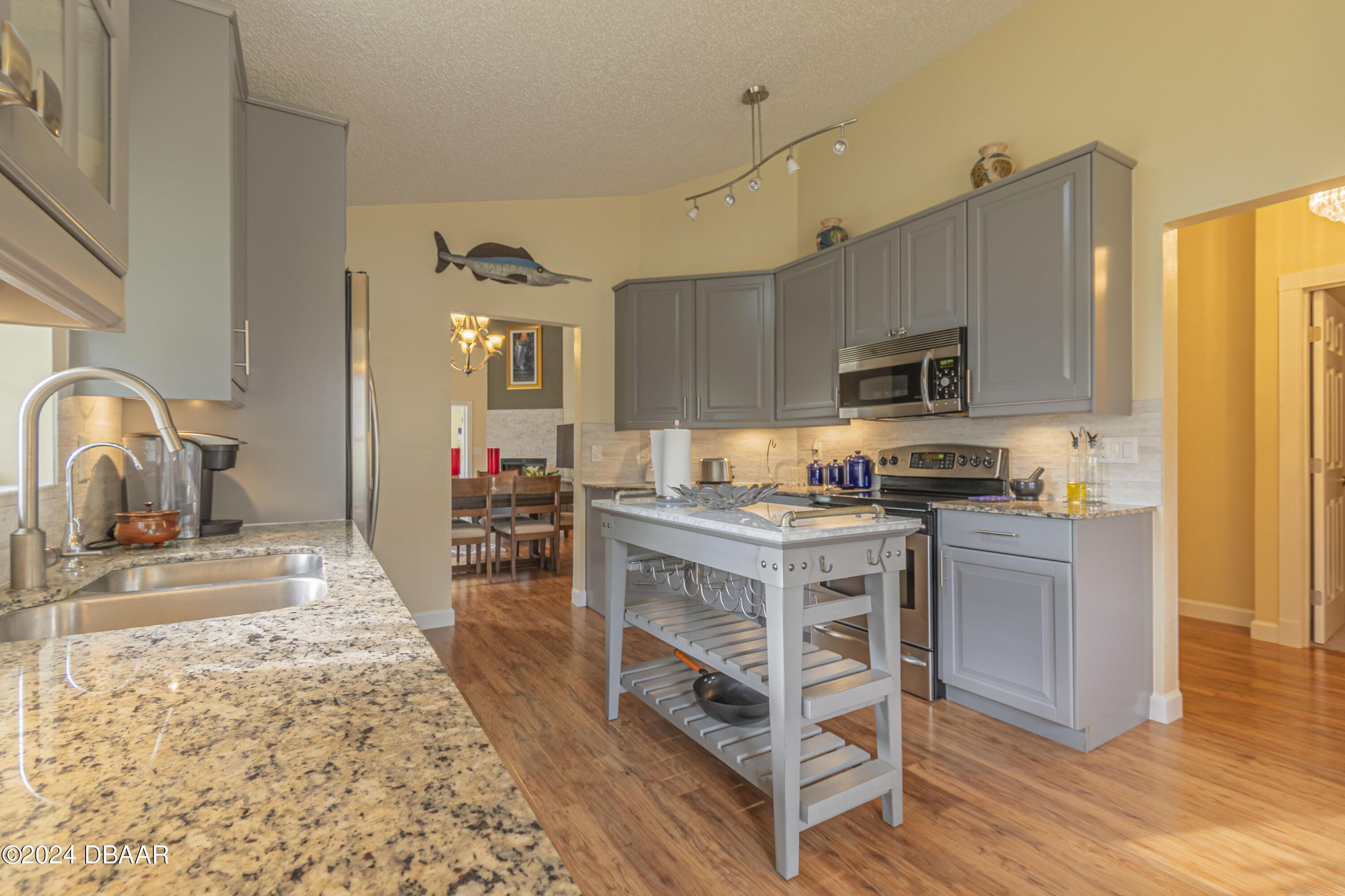 6236 Clover Bend Drive Port Orange, FL 32127 - Photo 13 of 73 a kitchen with a stove top oven and sink