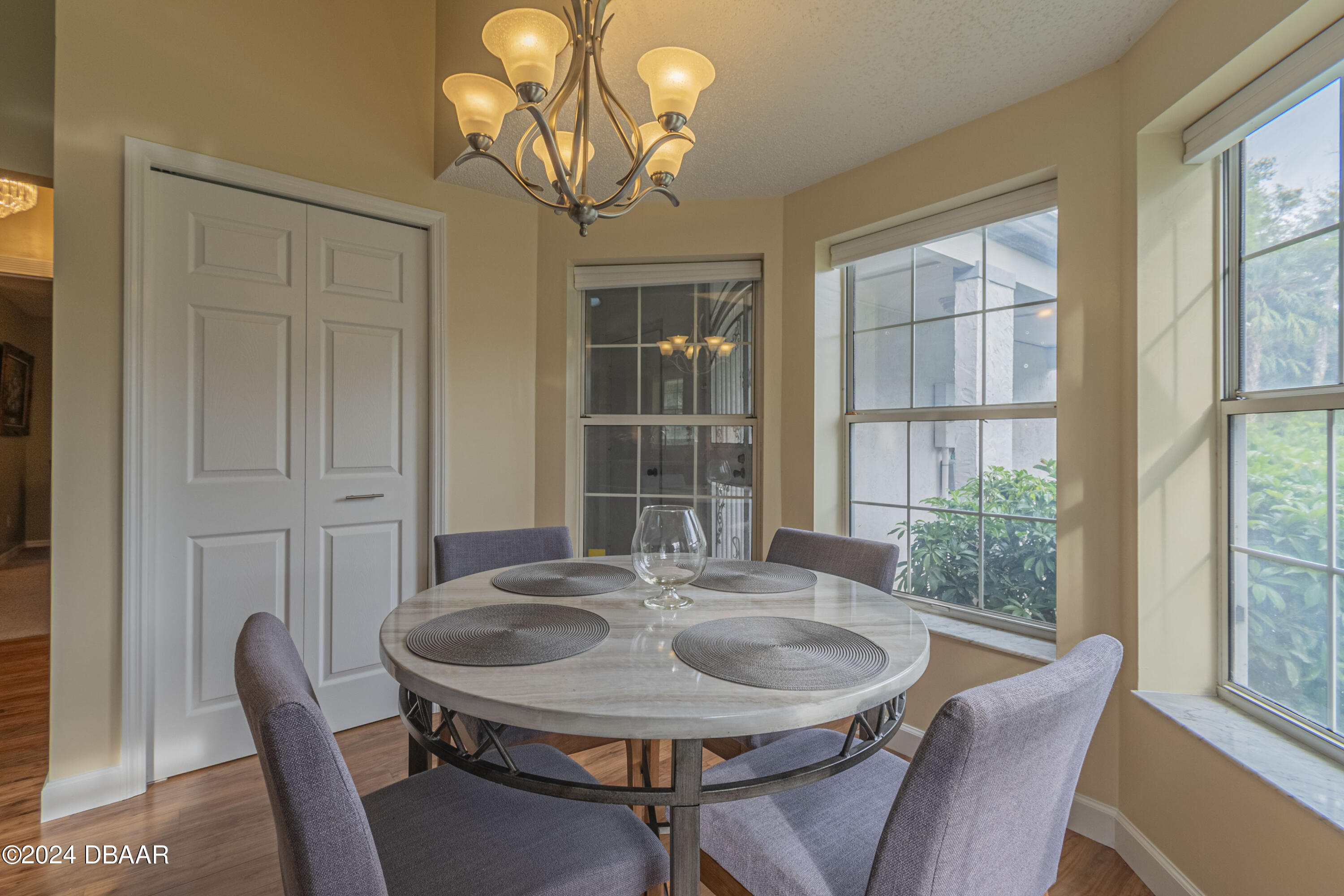 6236 Clover Bend Drive Port Orange, FL 32127 - Photo 15 of 73 a view of a dining room with furniture wooden floor and chandelier