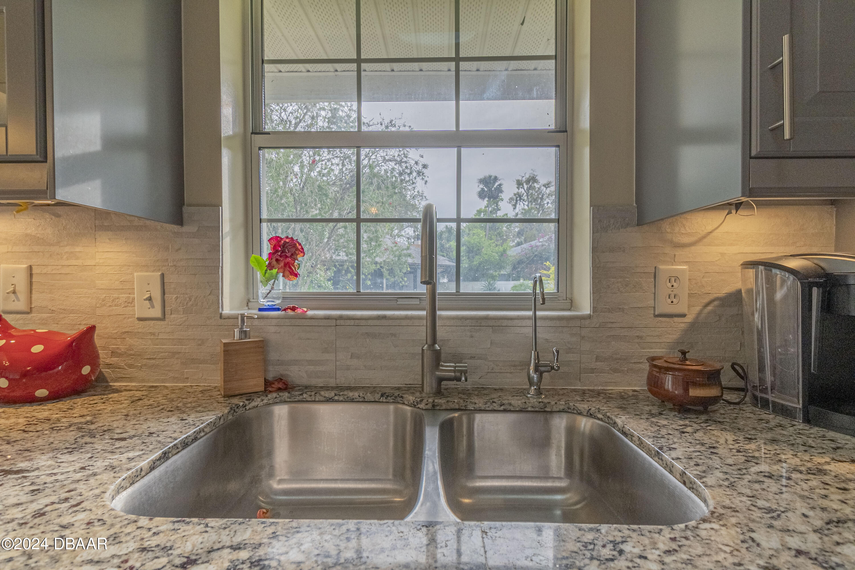 6236 Clover Bend Drive Port Orange, FL 32127 - Photo 19 of 73 a kitchen sink with granite countertop a sink and a wooden floor