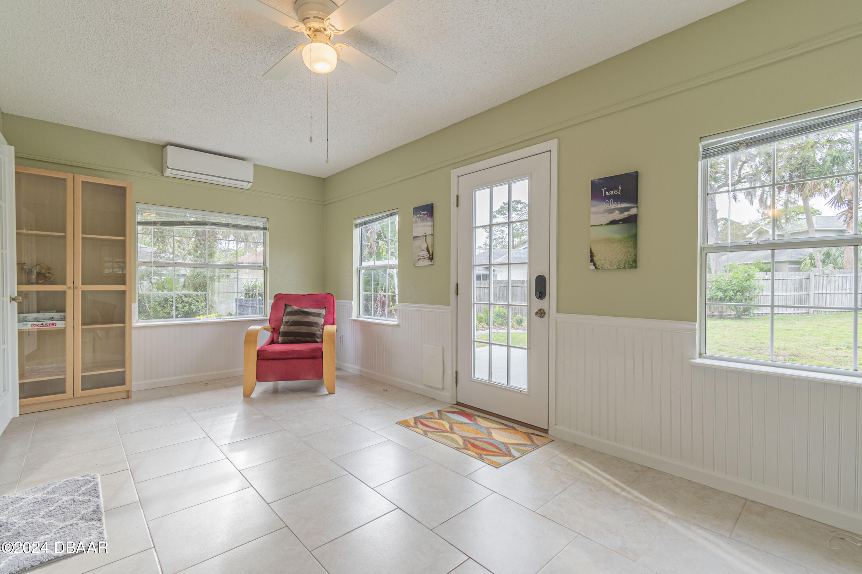 6236 Clover Bend Drive Port Orange, FL 32127 - Photo 23 of 73 a living room with furniture and a large window