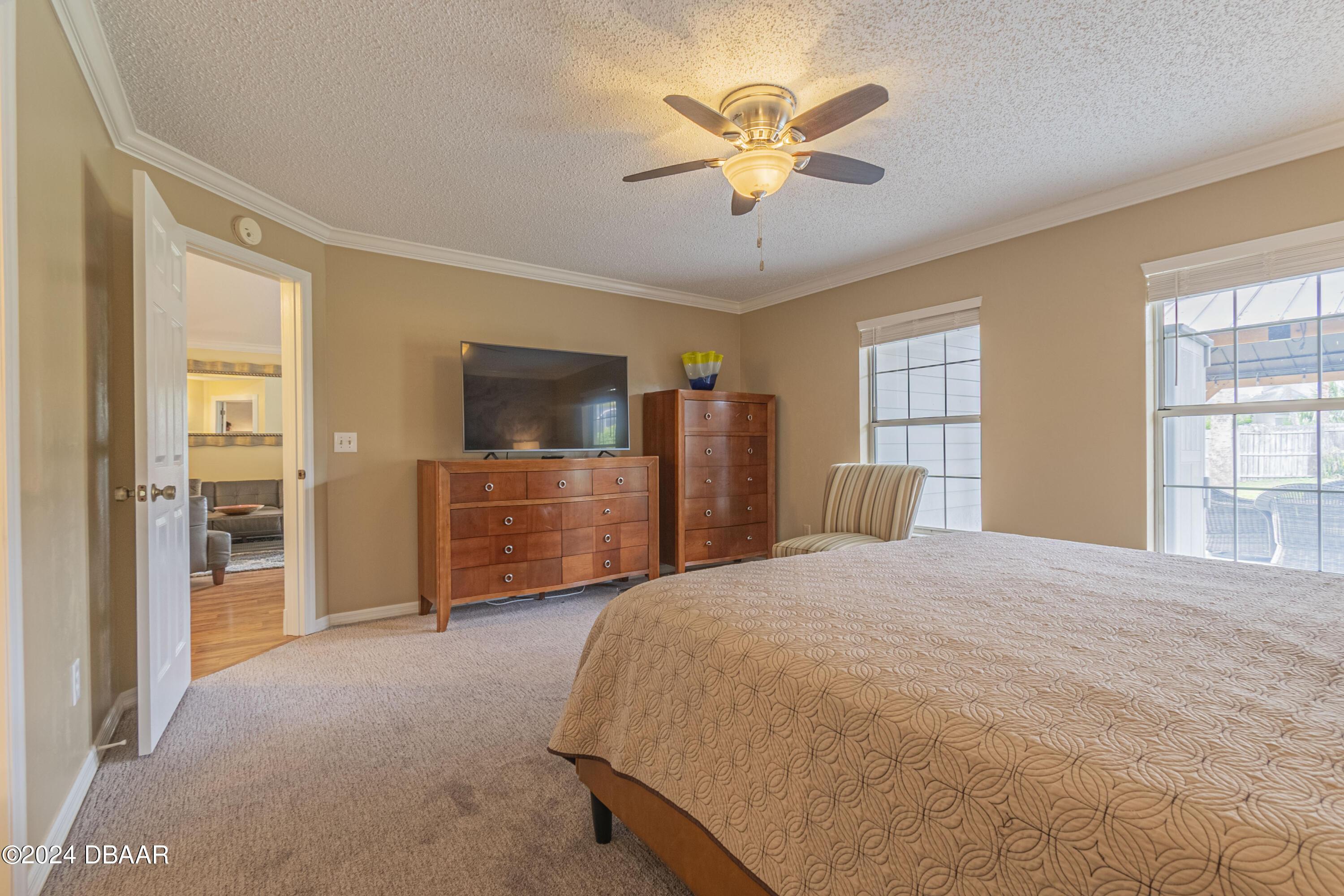 6236 Clover Bend Drive Port Orange, FL 32127 - Photo 26 of 73 a spacious bedroom with a bed and a flat screen tv