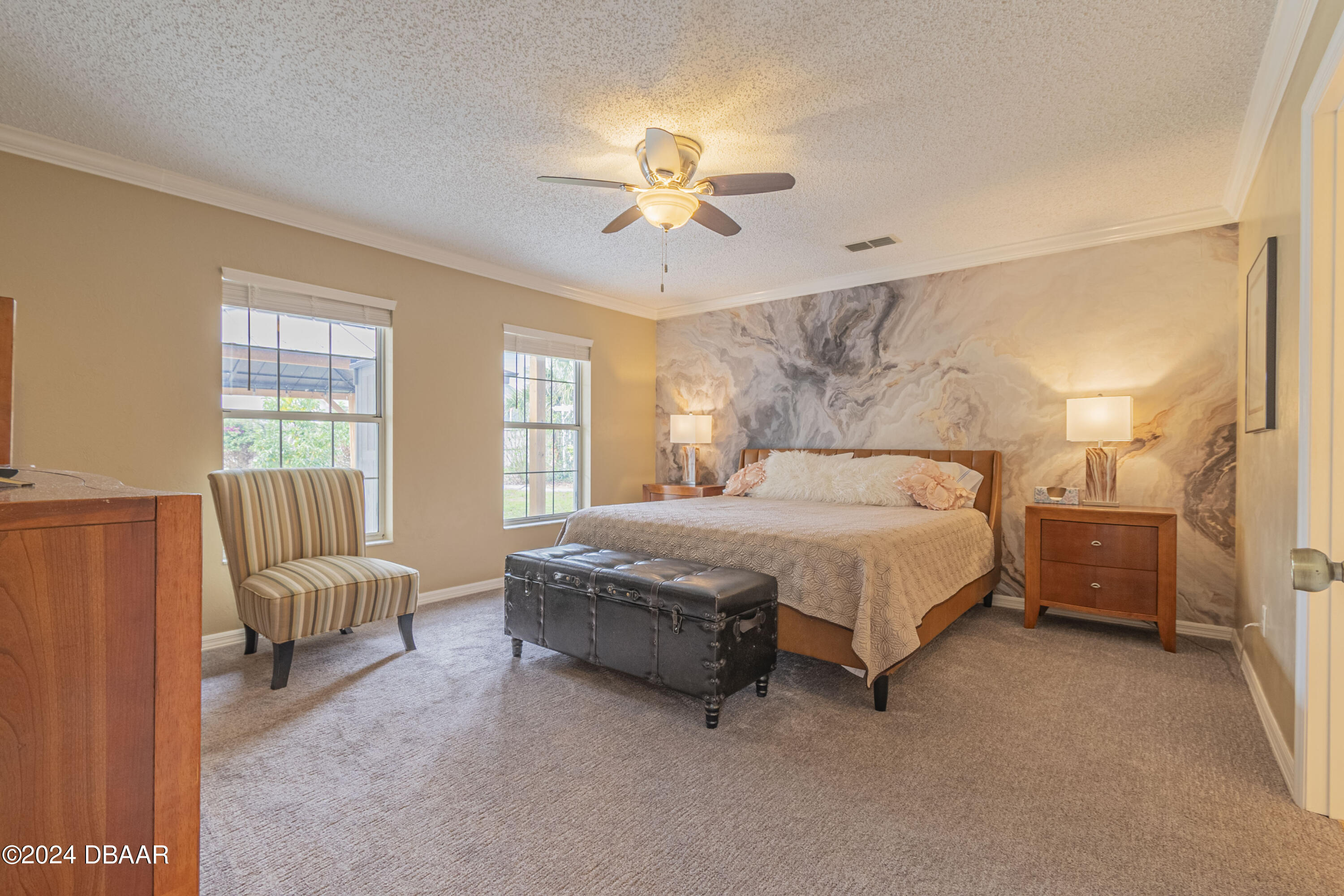 6236 Clover Bend Drive Port Orange, FL 32127 - Photo 27 of 73 a spacious bedroom with a bed and a chandelier