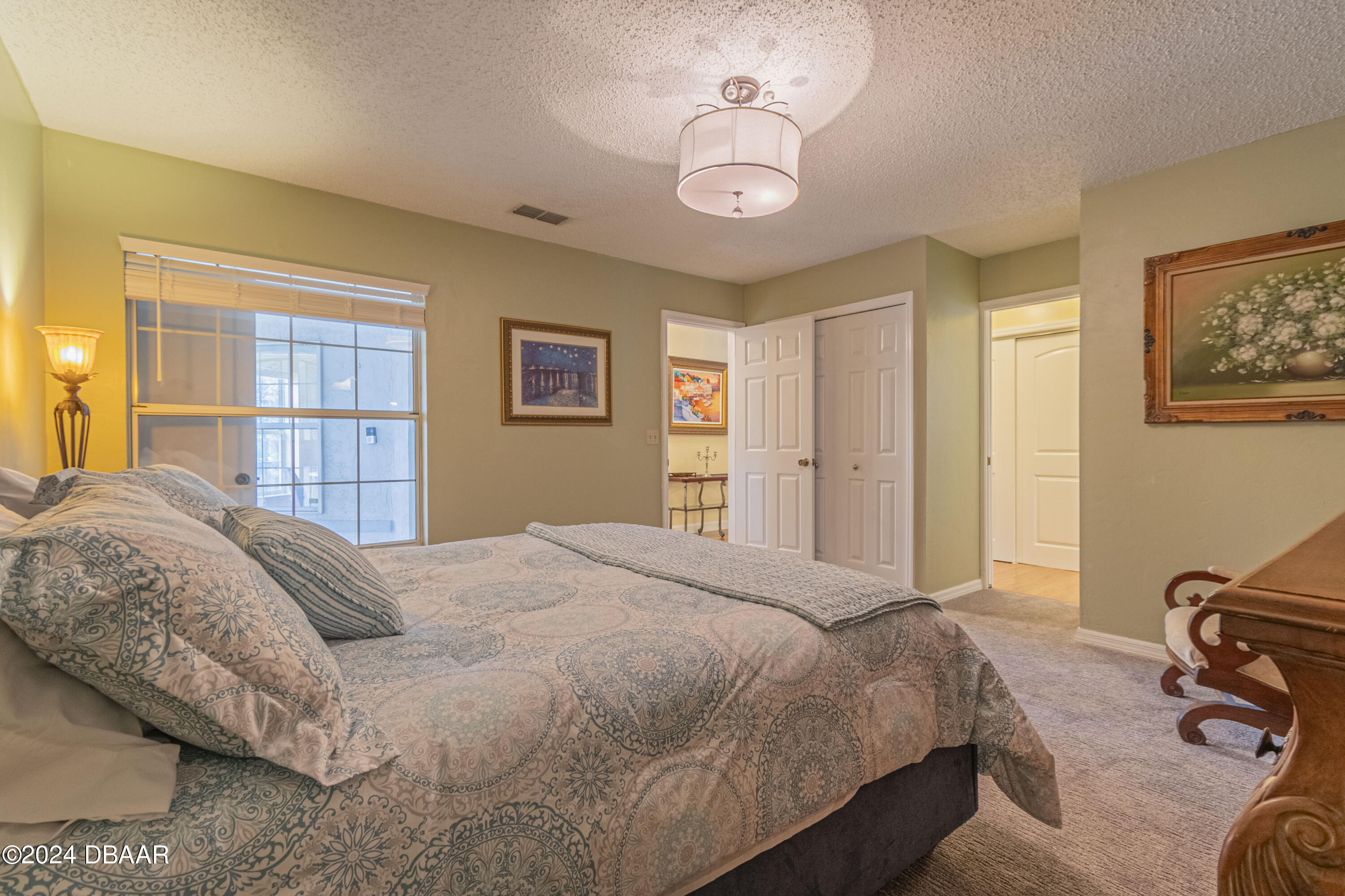 6236 Clover Bend Drive Port Orange, FL 32127 - Photo 29 of 73 a bedroom with a bed and a dresser