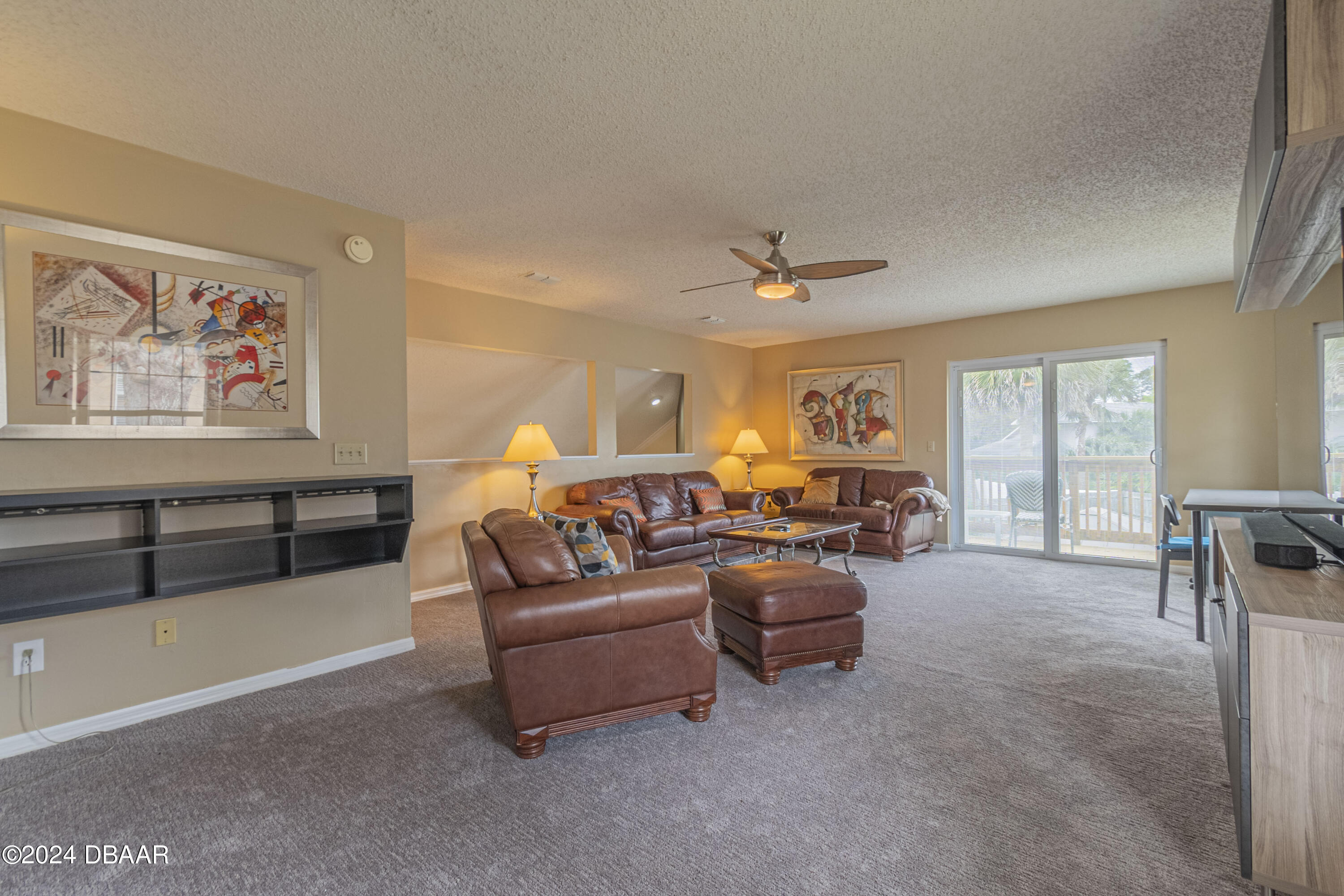 6236 Clover Bend Drive Port Orange, FL 32127 - Photo 33 of 73 a living room with furniture and a chandelier