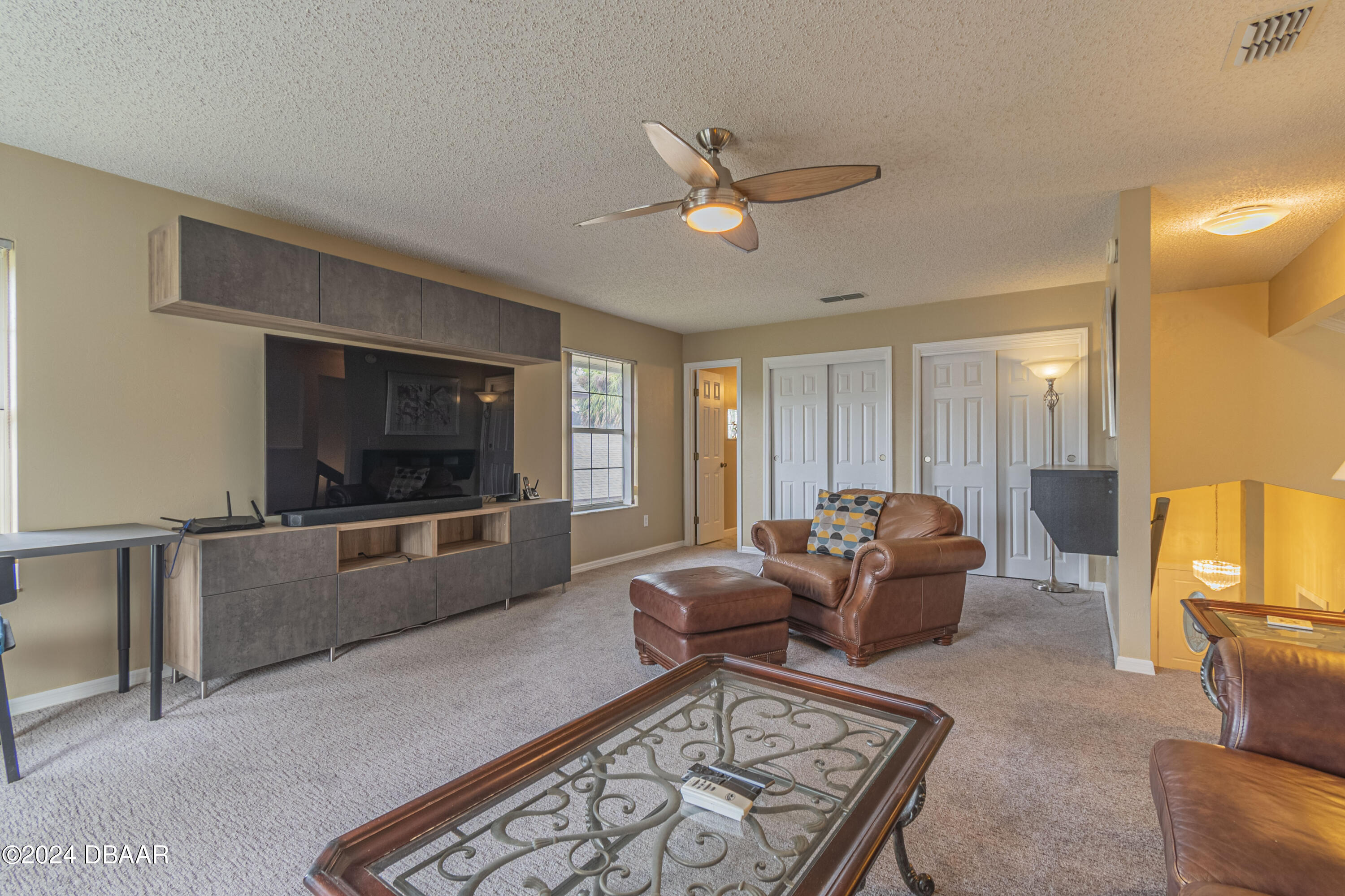 6236 Clover Bend Drive Port Orange, FL 32127 - Photo 35 of 73 a living room with furniture and a flat screen tv