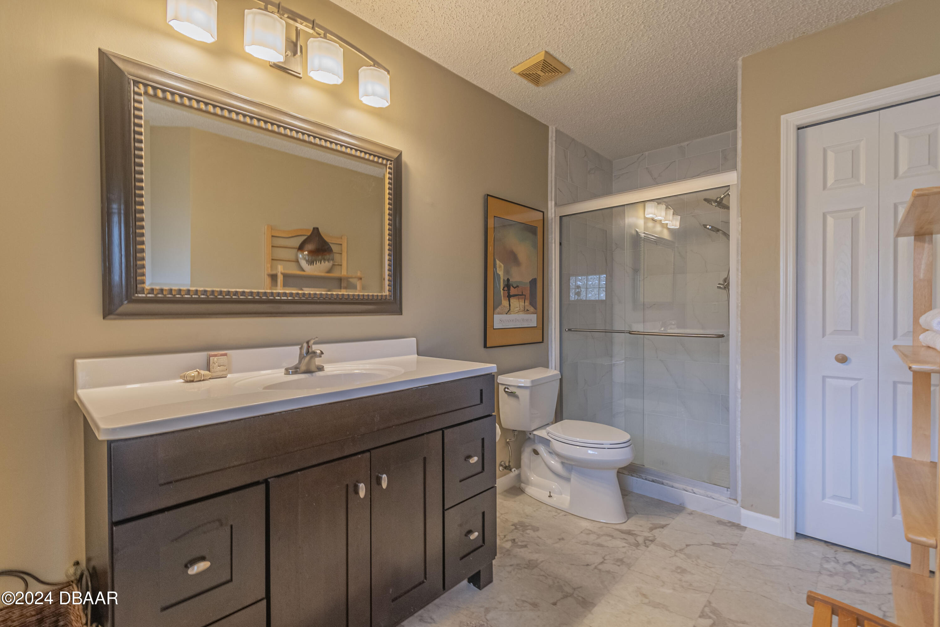 6236 Clover Bend Drive Port Orange, FL 32127 - Photo 41 of 73 a bathroom with a toilet sink and mirror